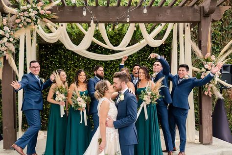 Mixing Greens and Blues for the Perfect Color Palette | Friar Tux Navy Suit Emerald Dress, Fall Wedding Colors Rustic Navy Blue And Grey, Navy Suits Green Bridesmaids, Navy And Green Wedding Party, Navy Suit Green Dress, Navy And Green Bridal Party, Emerald Green And Navy Wedding, Navy Emerald Wedding, Navy And Emerald Wedding