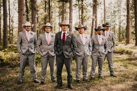 Gray, blush, and burgundy groomsmen with cowboy hats Cowboy Wedding Tuxedo, Cowboy Hat And Suit Wedding, Western Groomsmen Attire Grey, Burgundy And Blush Mens Wedding Attire, Burgundy Cowboy Wedding, Wedding Suit With Cowboy Hat, Grey Suit With Cowboy Boots, Groomsmen With Cowboy Hats, Suits And Cowboy Hats Wedding