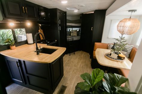 Black Cabinets In Camper, Dark Caravan Interior, Dark Rv Interior, Dark Camper Interior, Black Camper Interior, Boho Trailer, Green Interior Paint, Rv Decorating, Camper Redo