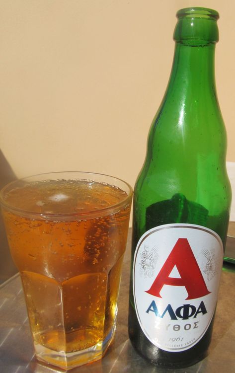 Alfa (Αλφα): Brewed by Athenian Brewery (Heineken) Style: Pale Lager. One of the oldest brands of beer in Greece, since 1961, and plays on its heritage with its authentic Greek name and origin proudly on display. Heineken Bottle, Greek Name, Pale Lager, Greek Names, Beer Drinker, Bottle Display, Bottle Stand, Beer Brands, Green Bottle