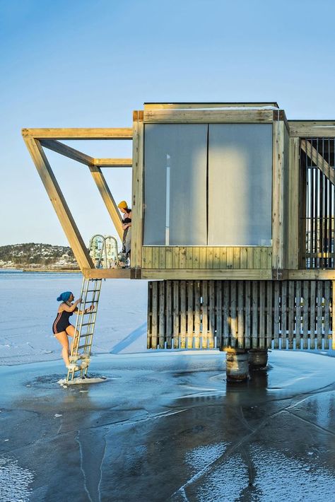 The bathing installations consist of two structures; a) the diving tower with a lookout platform and a light installation, and b) the sauna both of which will be open to the public year-round. The installations have drawn inspiration from industrial structures in the area: cranes, chimneys, silos, gantries, etc. #architonic #modernarchitecture #designinspiration #architecture #installation #bath #ourdoorbath #public Industrial Pool, Archi Student, Public Shower, Spring Architecture, Exhibition Building, Public Bath, Indoor Swimming Pools, Industrial Buildings, Bath House