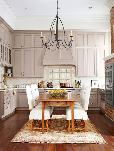 Table in the middle of the kitchen. Tall cabinets and ceiling. Wood floors. Kitchen Dark Walls Light Cabinets, Scandinavian Eat In Kitchen, Small Eat In Kitchen Table, Creole Cottage, Farmhouse Kitchen Island, Kitchen Island With Seating, Island With Seating, Farmhouse Style Kitchen, House Remodel