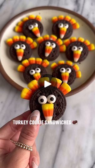 88K views · 1K reactions | NO BAKE TURKEY COOKIES🦃

These no bake Turkey cookies are a fun and easy treat to make for your Thanksgiving festivities, and require 0 baking! 

What you’ll need:
1. Favorite chocolate sandwich cookies (I used @simplemills) 
2. Candy corn
3. Candy eyes
4. Melted chocolate of choice

How to make them:
1. Take apart your cookie sandwich
2. Press in 5 candy corns into the filling. You can also dip the ends in melted chocolate to help them adhere better to cookie.
3. Carefully place the other half of cookie on top
4. Add melted chocolate to back of candy eyes and place on cookie
5. Add melted chocolate to back of candy corn and place below the eyes.
.
.
#turkeycookies #festivefood #thanksgivingdesserts #thanksgivingfood #nobakedessert #nobakerecipe #easydesserts #f Turkey Cookies Decorated, Candy Corn Mix, Oreo Turkey, Holiday Deserts, Thanksgiving Festivities, Easy Treats To Make, Thanksgiving Candy, Candy Eyes, Thanksgiving Snacks