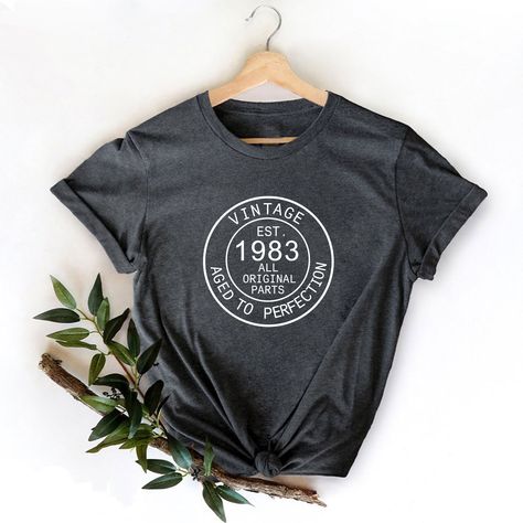 1983 Vintage Shirt, 40st Birthday Shirt, 1983 Birthday Shirt, 40th Birthday Gift, 1983 Classic Shirt, Born In 1983 Tee, 1983 Vintage Tees, 40 Birthday Party, 40 Birthday Gift, 1983 Vintage Shirt, 40 Years Bday Tee, 40th Birthday Shirt, Fortieth Birthday, 1983 Gift Shirt, Gift for 40th Bday, Classic 1983 Shirt, Born In 1983 Tee, 40th Gift for Wife, Retro 40th Birthday, Vintage 1983 Shirt  Hello, welcome to MerryShirtUS! I'm very happy to see you here. Please contact me if you have any questions/c Funny Birthday Shirts, 30th Birthday Shirts, Married Shirt, 40th Birthday Shirts, Family Vacation Shirts, Birthday Party Shirt, Old Shirts, Wedding Shirts, Funny Mom Shirts