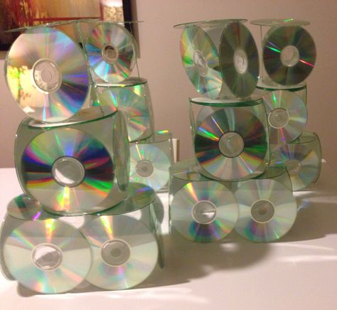 CD tower centerpieces, made with CDs and a lot of hot glue 2000s Centerpiece Ideas, Cd Centerpiece Ideas, 1990 Party, Vans Party, 2000s Party Theme, Cd Tower, 90s Themed Party, Valentine Banquet, 90s Party Decorations