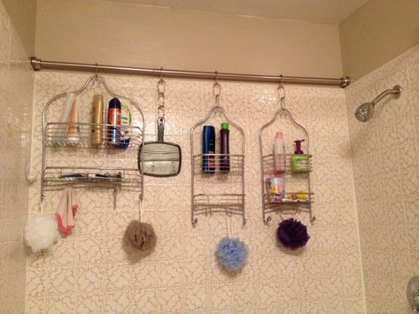 Install a tension rod in your shower and hang multiple shower caddies for additional storage. Makeover Kamar Mandi, Rv Bathroom, Bathroom Hacks, Bathroom Storage Solutions, Shower Organization, Ideas Para Organizar, Small Bathroom Storage, Downstairs Bathroom, Shower Rod