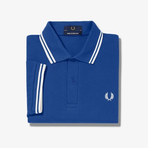 Fred Perry Heritage Brand That's Known Across The World For Its Unique Styling And History, This Classic And Original Twin Tipped Polo Shirt Comes With Tipping On The Collar And Sleeve. Made In Leicester, England And With An Adopted Fred's Signature Streamlined Fit. Made In The Uk And Influenced By Britains Mod Subculture. This Is A Iconic Cult Favorite And Will Be A Closet Staple For Years To Come. Mens Polo In Royal Size : 46" Chest Model : M12 Msrp : $110.00 - Classic Polo Shirt - Slimmer Fit Luxury Blue Collared Polo Shirt, Fred Perry Outfit Men, Perry White, Pink Polo Shirt, Fred Perry T Shirt, Navy Moisture-wicking Collared Polo Shirt, Navy Collared Moisture-wicking Polo Shirt, Leicester England, Fred Perry Polo