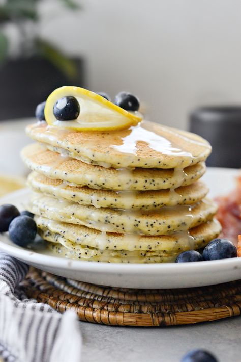 Lemon Poppy Seed Pancakes - Simply Scratch Fluffy Lemon Ricotta Pancakes, Poppyseed Pancakes, Blueberry Ricotta Pancakes, Poppy Seed Pancakes, Maple Syrup Glaze, Lemon Poppyseed Pancakes, Weekend Brunch Recipes, Lemon Pancakes, Light And Fluffy Pancakes