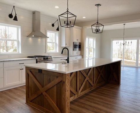 (paid link) The Kitchen Lighting Ideas You've Been Looking For Open Kitchen And Living Room With Island Farmhouse, American Farmhouse Style Kitchen, Farmhouse Kitchen With Sink In Island, Stained Wood Island White Cabinets, Beam Across Kitchen, Largest Kitchen Island, Rustic Modern Kitchen Island, Kitchen Open Floor Plan With Island, Simple Modern Farmhouse Kitchen