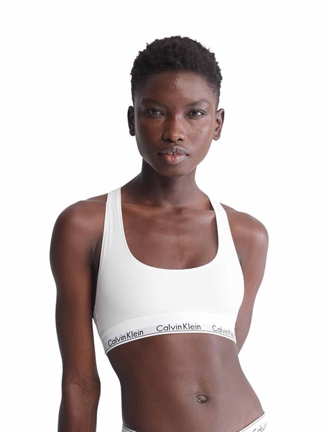 PRICES MAY VARY. LESS IS MORE: Unlined and underwire-free, this Calvin Klein bra combines the label’s famously sporty-sexy look with the feel of a favorite tee. MODERN COTTON: Spun in premium cotton yarns with silky modal and a hint of stretch, CK’s signature bras for women are lightweight, super-soft and breathable. EFFORTLESS: An easy, pullover raceback silhouette makes dressing stress-free. SUPER-SOFT: Smooth and lightweight, this wireless bra for women has an ultra-soft, flexible band that r Calvin Klein Shop, Calvin Klein Bra, Women Bras, Cotton Bralette, Comfy Bra, White Bralette, Wireless Bra, Womens Bras, Calvin Klein Woman