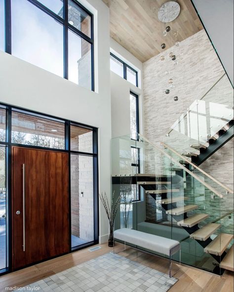 Making a statement with this front entrance • Our custom integrated residence welcomes you inside with this stunning ambience. A mahogany… Glass Stairs Design, Modern Foyer, Staircase Design Modern, Glass Stairs, Modern Entrance, Glass Staircase, Stairway Design, Stairs Design Modern, Modern Entryway