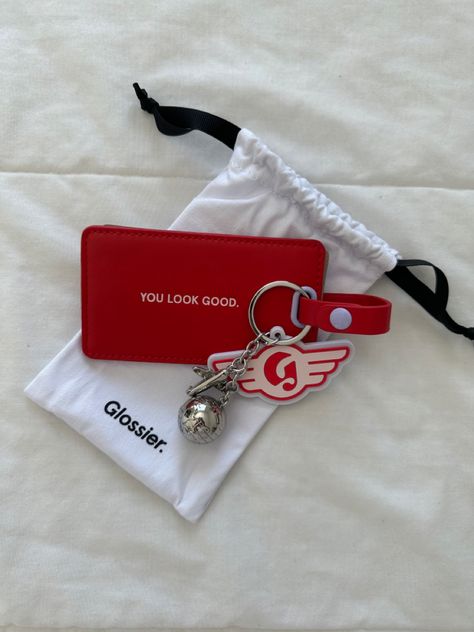 glossier, red luggage tag, keychain Luggage Tag Aesthetic, Preppy Luggage, Influencer Trip, Brands Aesthetic, Cute Luggage Tags, Suitcase Tags, Cute Luggage, Pretty Skin Care, Pretty Skin