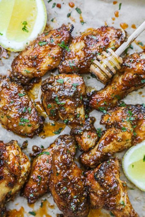 Honey Lemon Pepper Chicken Wings are the perfect combination of savory, sweet, and zesty. The skin is sticky and crispy and the meat is tender, juicy, and falls off the bone. Follow our simple instructions for broiling or baking depending on your preference! Make with our homemade lemon pepper seasoning or store-bought. Either way, you will love these wings for parties, game day, or a simple weeknight meal. Honey Lemon Pepper Chicken, Baked Lemon Pepper Wings, Honey Garlic Wings, Pepper Chicken Wings, Honey Garlic Chicken Wings, Garlic Wings, Lemon Pepper Chicken Wings, Garlic Chicken Wings, Lemon Pepper Wings