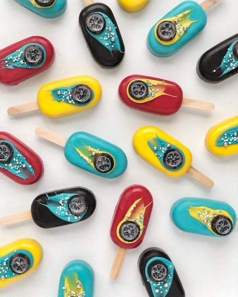 Simply Jeanius Cakes on Instagram: “Hot Wheels inspired cakesicles. • • • • • • #cakesicles #cakesiclesofinstagram #cakepops #cakepopstagram #hotwheels #favors #sweettreats…” Hot Wheel Cake Pops, Race Car Cakesicles, Monster Truck Cakesicles, Hot Wheels Treats, Hot Wheels Dessert Table, Hot Wheels Cupcakes Ideas, Hot Wheels Cake Pops, Sonic Pasta, Popsicles Cake