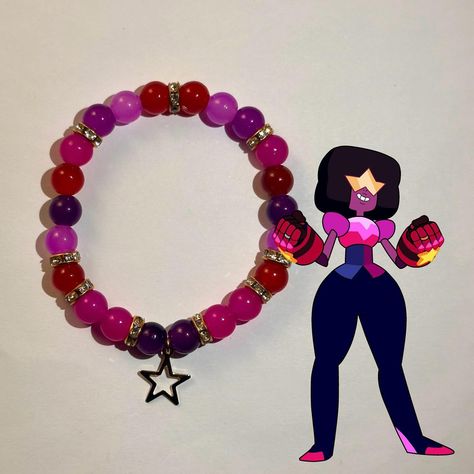 The Crystal Gems 🌟💫 Inspired by Steven🩷💛, Pearl 🤍🩵, Amethyst 🖤💜, and Garnet❤️💙 • Grab our Steven Universe inspired bracelets while supplies last. Shop LuvTreasured and fill your wrist with treasure — ★ ☄️ • • • • • if viewing, follow @luvtreasured on instagram and tiktok #beadedbracelets #jewelry #bracelets #monsterhigh #draculaura #clawdeenwolf #cleodenile #frankiestein #explorepage #luvtreasured Amethyst And Garnet, The Crystal Gems, Garnet Steven, Garnet Steven Universe, Inspired Bracelets, Pearl Amethyst, Crystal Gems, Steven Universe, Monster High