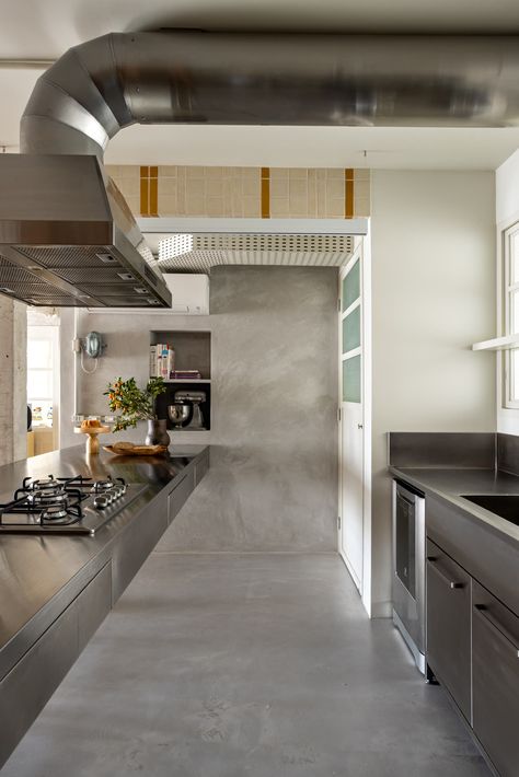 Photo 20 of 22 in Creamy Tile Polishes Up a Brazil Apartment’s Rough Concrete Edges - Dwell Brazil Apartment, Concrete Apartment, Metal Cabinet, Range Hood, Concrete Floors, Kitchen Room, Modern Kitchen, Brazil, Tile