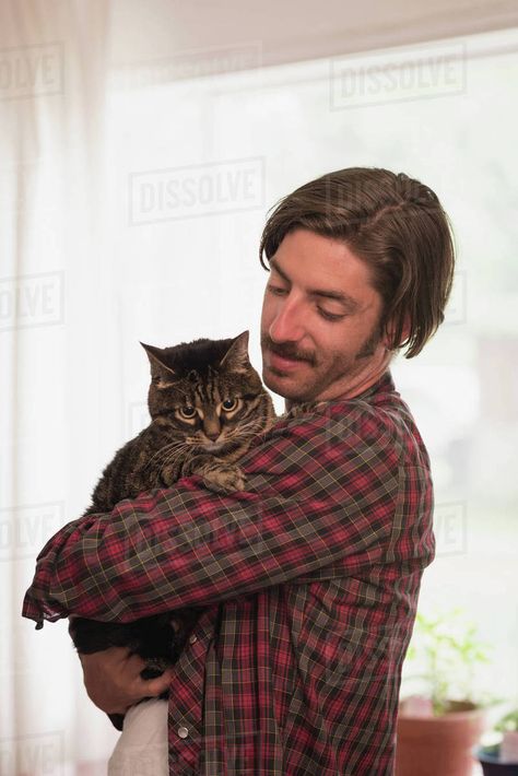 Man holding cat stock image Hold Cat Pose, Man Holding Cat Reference, Staring Pose Reference, Holding An Animal Pose Reference, Holding Cats Reference, Person And Cat Reference, Holding A Present Reference, Person Holding Dog Reference, Hugging Cat Reference