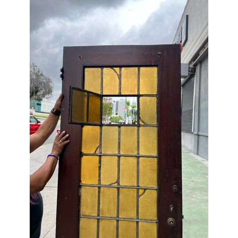 Authentic Spanish Revival Leaded Glass Stained Glass Door - Timeless Elegance with Amber Colored Glass, Original Hardware, and Raw Wood Finish  Transform your home into a Spanish Revival masterpiece with this magnificent leaded glass stained glass door. Crafted with meticulous attention to detail, this door captures the essence of Spanish Revival architecture, featuring amber colored glass, original hardware, and a Raw wood finish. Elevate the aesthetics of your space and immerse yourself in a w Wooden Stained Glass Front Door, Teak Door Frame Design, Painted Door With Stained Wood Trim, Round Window Exterior, Spanish Door Design, Unique Bathroom Door Ideas, Antique Wood Door, Stained Glass Doors Entrance, Stained Glass Doors