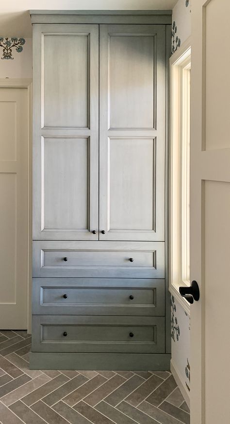 Blue stained bathroom linen closet in primary bathroom with herringbone grey brick flooring Vanity With Linen Cabinet, Closet In Bathroom, Cherry Bathroom, Primary Bathroom Remodel, Linen Closet Design, Bathroom Linen Closet, Herringbone Tile Floors, Tall Bathroom Storage Cabinet, Cabinet Pantry