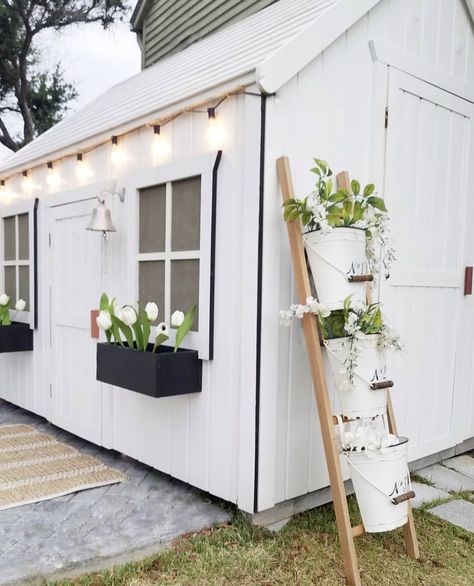 white painted shed with black edging, leaning ladder for plants // fort & field White Paint Black Trim, Shed Exterior Ideas, White Shed, Black Shed, Painted Shed, Shed Landscaping, Shed Makeover, Shed Building, Garden Cabins