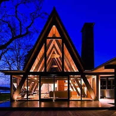 First popularized for their simple design and affordable cost, today's A-Frames are finding renewed interest with design modifications that expand them out—and up. Triangle House, A Frame Cabins, A Frame House Plans, Architect Design House, Frame House, A Frame Cabin, A Frame House, Wooden House, Cabin Homes