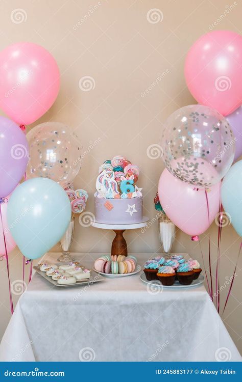 A cake standing on a table decorated for a birthday. Balloons, cakes, lollipops Cake Table Decorations Birthday, Balloon Table Centerpieces, Birthday Cake Stand, Homemade Lollipops, Fairy Birthday Cake, Cake Table Birthday, Cake Table Decorations, Balloon Arrangements, Balloon Cake