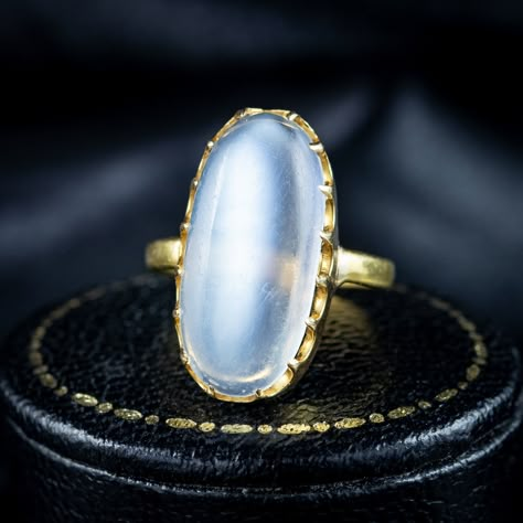 Look at that blue glow! An enchanting antique early Victorian moonstone solitaire ring boasting a magnificent cabochon moonstone, weighing approx. 6 carats. It has a lovely, smooth surface that is semi-transparent and exhibits a bright, silvery-blue schiller that floats across the surface when it catches the light. The moonstone is held securely in an 18ct gold claw mount and features Birmingham hallmarks within the band that have worn over time but appear to date to 1842. It’s a wonderful ... 5 Days Left, Edwardian Engagement Ring, Silvery Blue, Blue Glow, Blue Moonstone, Pretty Clothes, Moon Goddess, Moonstone Jewelry, Semi Transparent