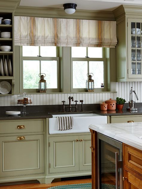 We love this porcelain farmhouse sink in this costal cottage kitchen! Tour the rest of the home here: http://www.bhg.com/home-improvement/remodeling/before-and-after/a-coastal-cottage-renovation/?socsrc=bhgpin052913farmhousesink=8 Homey Kitchen, Farmhouse Kitchen Curtains, Green Kitchen Designs, Kabinet Dapur, Cottage Renovation, Cabinet Finishes, Green Cabinets, Kitchen Redo, Cottage Kitchen