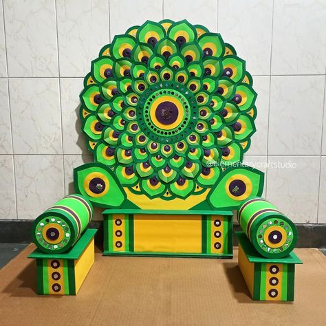 Paper Mandala Mirror Decoration for Ganpati 🦚💚✨ (Handcrafted/ Sustainable/Detachable/Easy to assemble) Suitable for 18" to 22" inch murti Recommended for 20 inch murti. Size: Back 32 inch height, width 24 inch. Colour: Dark Green, Parrot Green, Yellow and Violet. Materials used: Corrugated Boxboard, Coloured Paper, Small Mirrors, White Glue and Paper tape. Set Includes: 2 loads, 2 load base, 2 feathers, 1 back and 1 stand. "All parts are detachable & easy to assemble." Note only local orde... Small Decoration For Ganpati, Bajot Decoration, Ganpati Background, School Decorations Diy, Eco Friendly Ganpati Decoration, Paper Mandala, Mandala Mirror, Simple Stage Decorations, Ganpati Decoration At Home