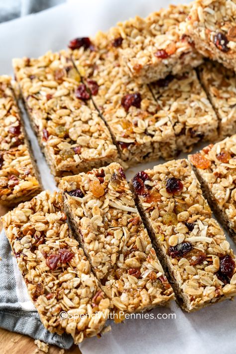 My family loves these chewy granola bars! With a base of oats, Rice Krispies, coconut and a little honey, I let my family choose their favorite dried fruit, nuts, chocolate or other add-ins to make a granola bar that is completely theirs!  It's a homemade snack they are sure to love! #spendwithpennies #nobakegranolabars #10minutes #grabandgobreakfast #snack #kidfriendly Bars With Oatmeal, Granola Bar Recipe Healthy, No Bake Granola, Easy Homemade Granola, No Bake Granola Bars, Homemade Buttermilk Biscuits, Healthy Granola Bars, Chewy Granola Bars, Baked Granola