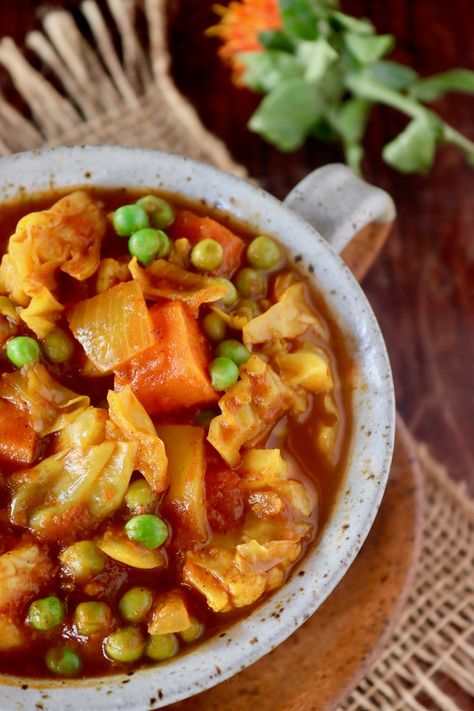 Vegetarian Cabbage Stew with Turmeric is as hearty as stew with meat, and as delicious as can be! Cooking with fresh turmeric is the key, and it's packed with tender vegetables in a rich blend of spices and tomatoes -- you will devour every last bite! #cabbage #turmeric #stew #vegan #vegetarian #tomato Turmeric Stew, Asiago Bread, Dill Rice, Stew Vegan, Fresh Turmeric Root, Cabbage Stew, Vegan Stew, Turmeric Recipes, Canning Diced Tomatoes