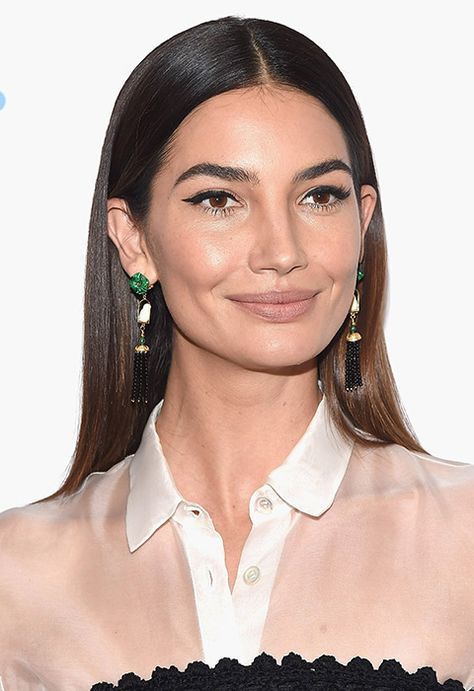 Lily Aldridge's straight locks are worthy of a hair ad: glossy beyond your wildest dreams. After you've washed your hair, condition with some smoothing products (like this Ouai fave) and blow dry with a diffuser. Then, brush using a Tangle Teezer, part in the middle and straighten from root to tip. Finally, tuck behind your ears and finish with a spritz of hold spray 100 Hairstyles, Goddess Hair, Hair Tuck, Middle Part Hairstyles, Goddess Hairstyles, Lily Aldridge, Slick Hairstyles, Ear Hair, Sleek Hairstyles