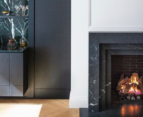 Audax’s Instagram post: “Casa Loma Pied-à-terre: The geometric forms of the Nero Marquina marble fireplace compliment the Verde Antico marble bar. The oak chevron…” Nero Marquina Marble, Nero Marquina, Marble Bar, Marble Fireplaces, Geometric Form, Room Redo, Marble, Fireplace, Instagram Posts