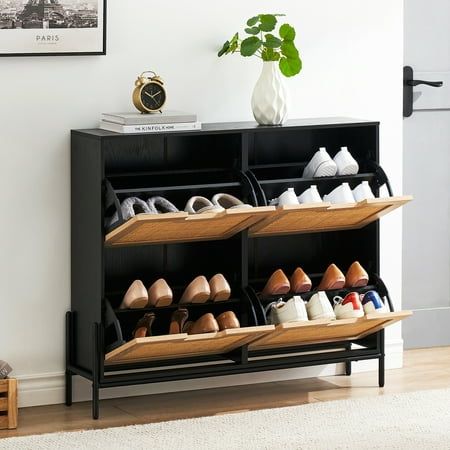 This shoe cabinet is made of sturdy medium-density fiberboard and hand-woven natural rattan, which is natural, moisture-proof, and insect-proof. The shoe cabinet looks more elegant and classic. The shoe cabinet designed with ingenuity makes full use of space, making your living room, hallway, and bedroom cleaner and tidier. The natural elements of rattan better decorate your home environment. Color: Black,Oak Material: Wood, Rattan, Iron Number of Doors: 4 Product Dimensions: 9.4"D x 39.4"W x 34 Rattan Shoe Cabinet, Shoe Cabinet Design, Flip Door, Modern Shoe Rack, Narrow Shoe Rack, Shoe Rack Storage, Wooden Shoe Racks, Entryway Shoe Storage, Entryway Shoe