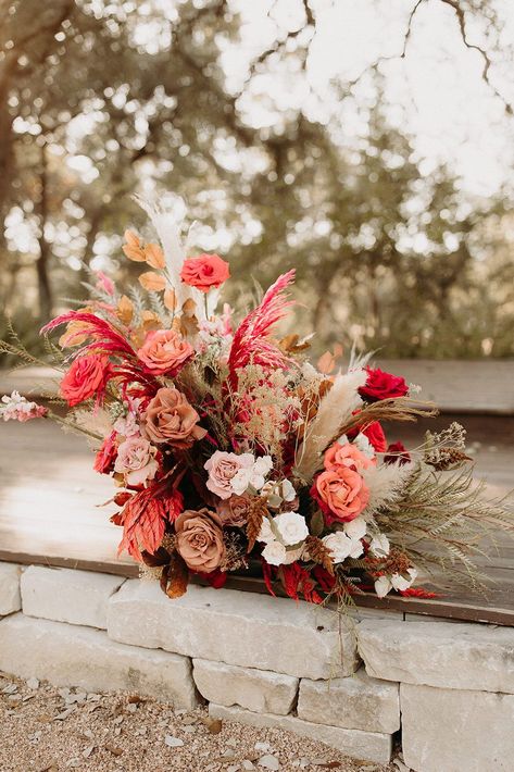 Boho Colorful Wedding, Pink And Red Wedding Flowers, Pampas Grass Wedding Ceremony, Grass Wedding Ceremony, Pampas Ceremony, Bright And Bold Wedding, Pink Boho Wedding, Hanging Floral Installation, Flowers And Pampas