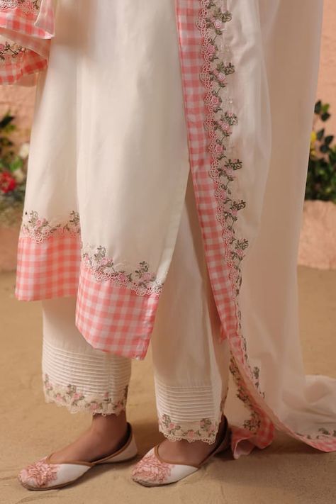 Ivory kurta with pintuck detailing on neckline, floral lace embellishment and checked placement pattern. Paired with pintuck pant and dupatta. - Aza Fashions Suit Designs With Laces, Pintucks Kurti Designs, Party Wear Western Dresses, Fancy Dress Patterns, Placement Pattern, Kurti Pants, Ladies Suit Design, Khadi Kurta, Cotton Suit Designs