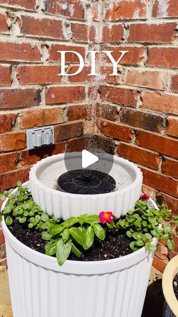 Dana | Home Decor • Organization on Instagram: "HOW TO create a beautiful DIY water feature for your outdoor decor! I recently saw someone post this idea and I had to create one of my own! 

Comment DIY to get the links for the supplies needed sent to your DMs.

This easy DIY is perfect for your patio, poolside, or any where in your yard! 

All you need is these two VIRAL PLANTERS from @walmart, this solar powered fountain from @amazon, beautiful flowers, water and sun and voila…you have an eye-catching water feature!

PSA… these planters do sell out but are restocked often!  Also, I ended up removing the rocks so the fountain could float better! 

Now, get started creating your own DIY water design!

#outdoordesign #outdoordecor #patiodecor #diyhomedecor #diyhome #diyhomeprojects #waterfe Solar Power Fountain, Solar Water Fountains Outdoor Diy, Solar Fountains Outdoor Diy, Solar Water Fountains Outdoor, Water Fountains Outdoor Diy, Diy Fountain Ideas, Outdoor Layout, Diy Solar Fountain, Solar Powered Fountain