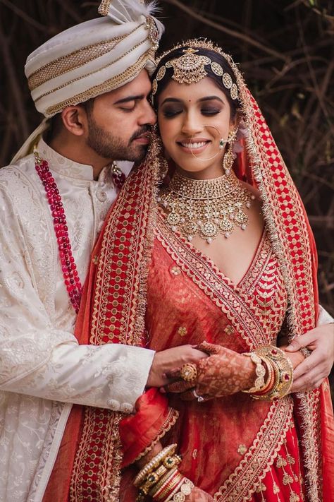 Bride with bold smokey eyes going in sync with her red Sabyasachi wedding look! Bride Groom Photoshoot, Bride Groom Poses, Indian Bride Photography Poses, Bride Photos Poses, Indian Wedding Poses, Groom Photoshoot, Indian Wedding Bride, Indian Wedding Photography Couples, Bridal Photography Poses