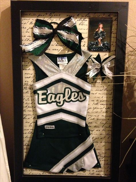 Cheerleader shadow box! Team Pic, bow, uniform, shoes. Framed Cheer Uniform, Senior Cheer Gifts, Jersey Frame, New Home Gift Ideas, Valentine Box Ideas, Choir Dresses, Cheer Banquet, Uniform Shoes, Cheer Gear