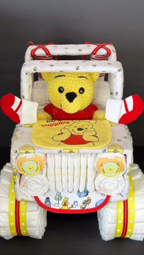 This adorable Winnie the Pooh jeep diaper cake is launching tomorrow, along with lots of other Jeeps! there’s only 1 right now, more… | Instagram How To Make A Diaper Cake For Baby Boy, Pooh Bear Diaper Cake, Diaper Jeep Instructions, Winnie The Pooh Baby Shower Gift Ideas, Winnie The Pooh Gift Basket, Winnie The Pooh Diaper Cake Ideas, Baby Shower Ideas Boy Theme, Gender Reveal Ideas Winnie The Pooh, Winnie The Pooh Baby Shower Cake