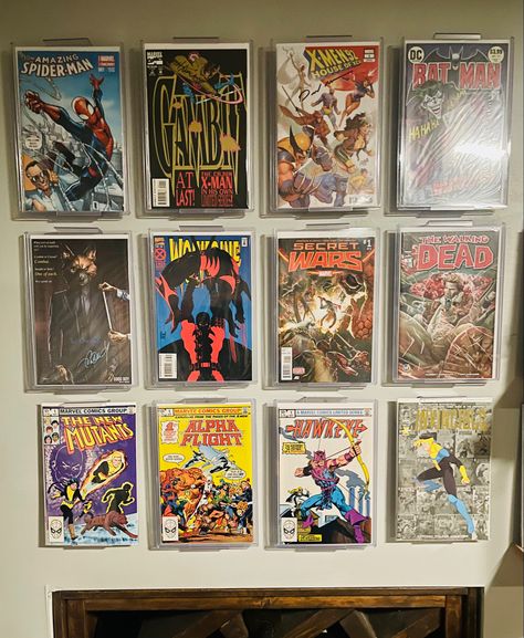 Great way to display your favorite books. Enjoy displaying my favorites and its super easy to swap out. Always gets compliments on the display. Comic Book Organization Ideas, Comic Book Collection Display, Comic Book Shelf Ideas, Comic Display Ideas, Comic Book Display Ideas, Comic Book Room Ideas, Comic Book Shelf, Comic Book Rooms, Comic Book Wall