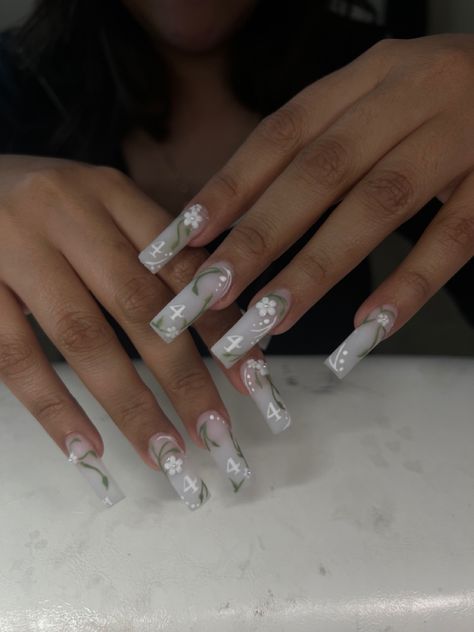 acrylicnails acrylic nails nail art Nail Inspired Medium Length, Cute Milky White Nails With Design, Milky White Nails Flowers, White Medium Length Nails, Milky White Nails With Flower Design, White Floral Acrylic Nails, Med Length Square Acrylic Nails, Soft White Nails With Designs, Milky White Nails With Gems