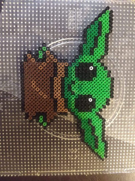 Grogu Perler Beads, Yoda Perler Beads Pattern, Disney Melty Beads, Iron Beads Disney, Baby Yoda Perler Beads, Perleplader Ideas Disney, Perler Bead Door Hanger, Perler Bead Patterns Disney, Cute Hama Bead Ideas