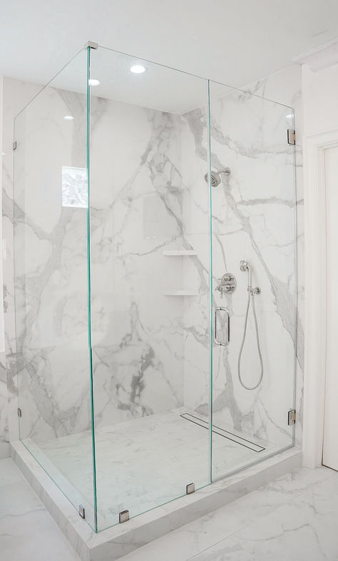 Image is a floor-to-ceiling shower with large-format porcelain in a white marble-like design. Tile For Shower Walls, White Marble Shower, Marble Shower Walls, Marble Shower Tile, Gross Things, White Marble Bathrooms, Organize Your Bathroom, Bathrooms Ideas, Master Bath Shower