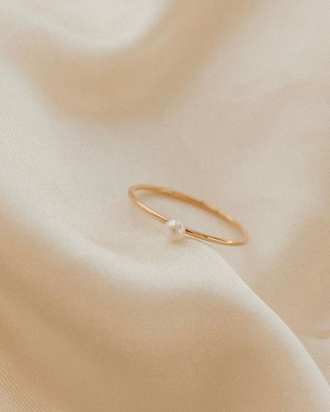 Our Pearl Ring is stunningly simple, and a staple piece for any wardrobe. This gold filled band ring features one of our pearls on an understated setting that completes the look. The Pearl Ring will live happily in your collection forever. Details: -Gold Filled -Size: 6, 7, 8, -Waterproof, Tarnish Free, Hypoallergenic Pearl Gold Rings For Women, Pearl Promise Ring, Dainty Pearl Ring, Simple Promise Rings, Dainty Promise Rings, Simple Pearl Ring, Pearl Promise Rings, Simple Promise Ring, Purity Rings