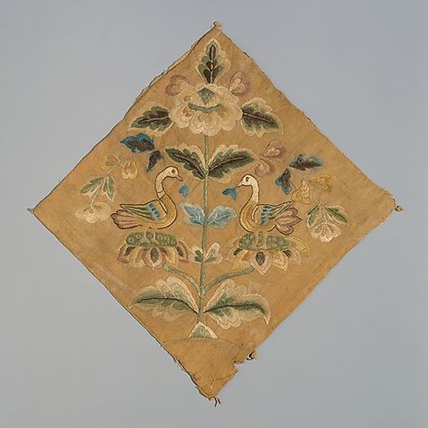 Textile with Confronted Birds, Tang dynasty (618–907), early 8th century, China, silk embroidery on plain-weave silk. Although symmetry is a basic element of Chinese design, the motif of a pair of confronted animals or birds on either side of a plant was not known in China until the opening of the silk routes in the second century B.C. The birds standing on lotus blossoms was a very popular motif in the early Tang period. Chinese Fabric, Chinese Embroidered, Chinese Embroidery, Silk Route, Chinese Design, Tang Dynasty, Silk Touch, Silk Ribbon Embroidery, Antique Textiles