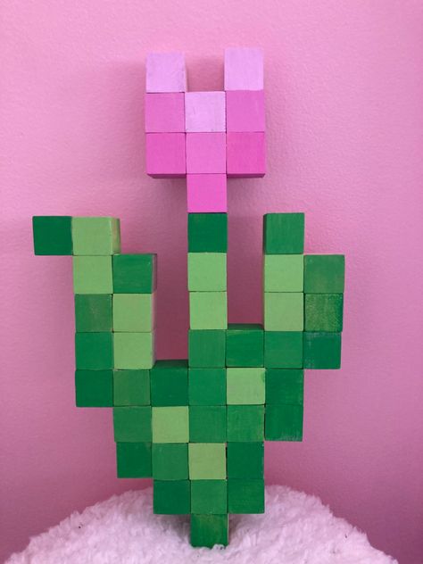 minecraft wooden tulip made out of wooden cubes Minecraft Block Painting, Minecraft Rose Diy, Diy Minecraft Painting, Wood Block Pixel Art, Minecraft Block Flowers Diy, Minecraft Wood Cube Art, Minecraft Rose Wooden Blocks, Minecraft Tulip 3d, Minecraft Wooden Block Crafts Flowers