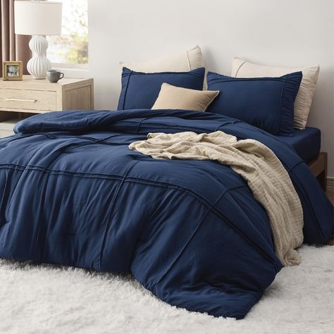 PRICES MAY VARY. Elegant Home Decor: This dorm room essential comforter set combines the exquisite pinch pleat design with a stripe pattern, bringing a touch of sophisticated style to your dorm room. Premium Filling: Featuring Bedsure's thoroughly tested microfiber filling blend, this down alternative comforter maintains the perfect balance between weight and warmth, transforming your bare dorm room into a cloud-like oasis. Extra Soft: The prewashed microfiber cover offers exceptional softness a Fluffy Bed Set, Navy Blue Bedding Sets, Navy Blue Bedding, Fluffy Bed, Soft Navy Blue, Boho Comforters, Blue Bedding Sets, Twin Comforter Sets, Fluffy Bedding