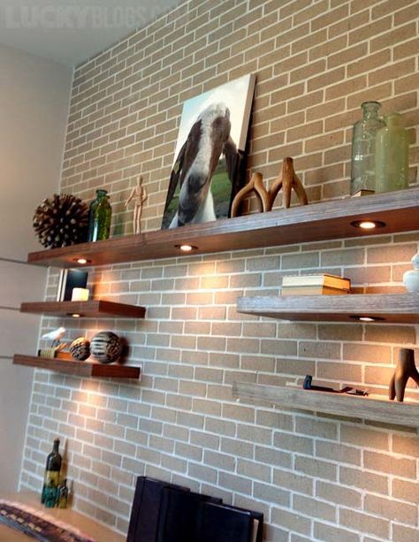 Floating Shelf On Brick Wall, Wood Shelf Brick Wall, Large Floating Shelves Office, Brick Wall With Floating Shelves, Staggered Floating Shelves Office, Lights Under Floating Shelves, Floating Shelves Office Wall Shelves, Large Wall Floating Shelves, Brick Wall Shelves