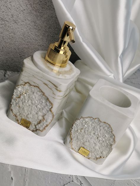 Transform your bathroom into a haven of sophistication with our handcrafted soap dispensers and toothbrush holders. Each piece is a unique masterpiece, seamlessly blending elegance with functionality. Elevate your daily routine and add a personalized touch to your space. Experience the extraordinary with our handmade treasures—because your bathroom deserves to be a canvas of luxury and individuality. Vanity Sets, Space Experience, Resin Work, Toothbrush Holders, Vector Art Design, Soap Dispensers, Resin Furniture, Handcrafted Soaps, Concrete Diy